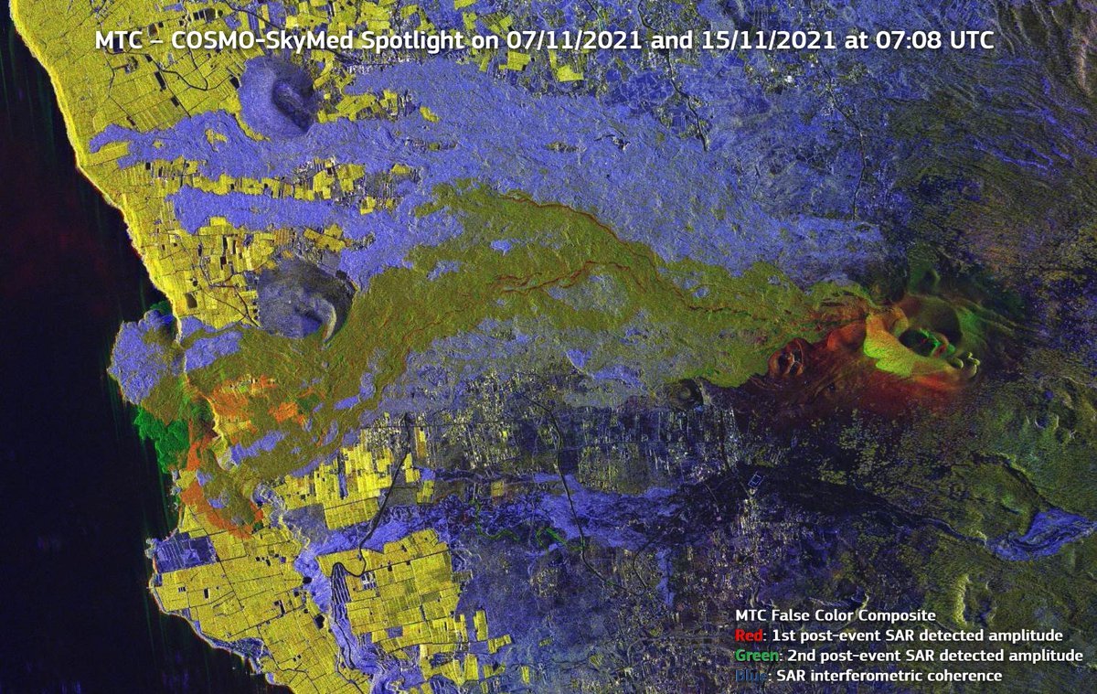 A false colour image of the lava flows, with the lava flows being mostly blue apart from the active parts which are green. Other unaffected land is mostly yellow